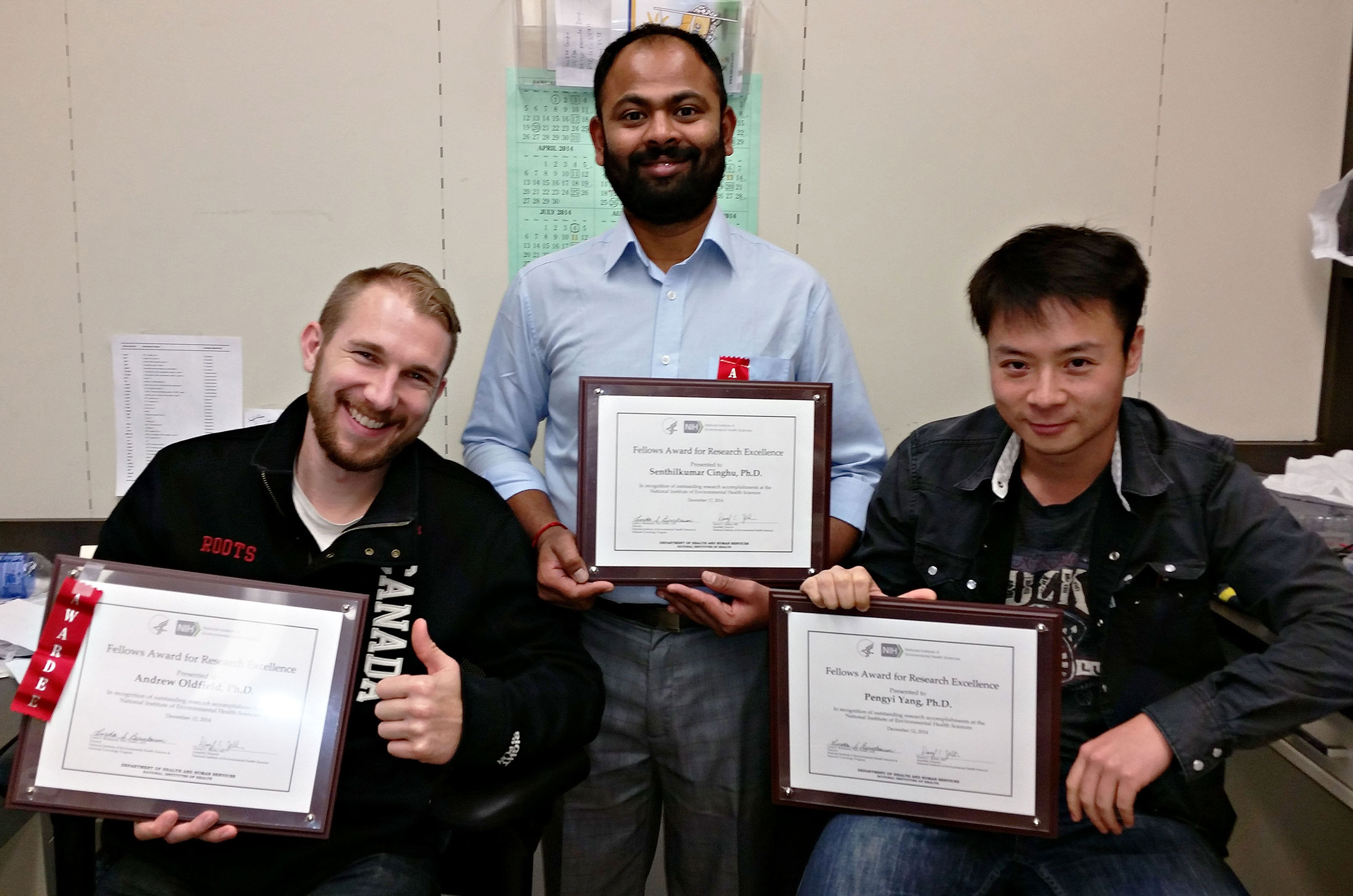 Andrew, Senthil, and Pengyi showing off with their NIH Fellows Award for Research Excellence. This is Senthil's second such award.